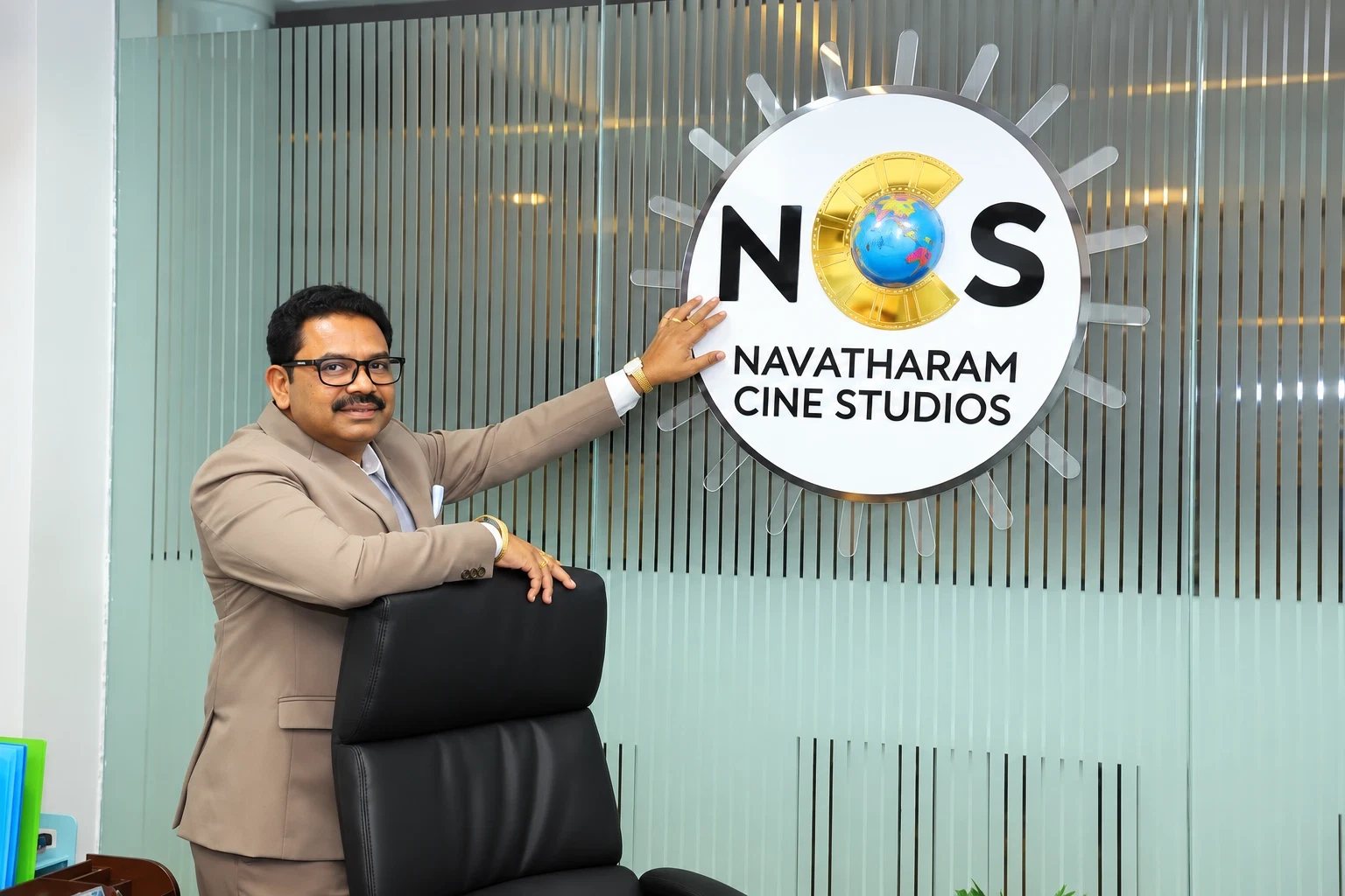 Dr. Tirupati Nagarjuna Rao with the Navatharam Cine Studios logo